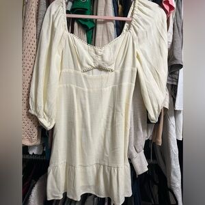 New without tags  cream dress w ruffle bottom and cut out, stunning, 3/4 sleeves